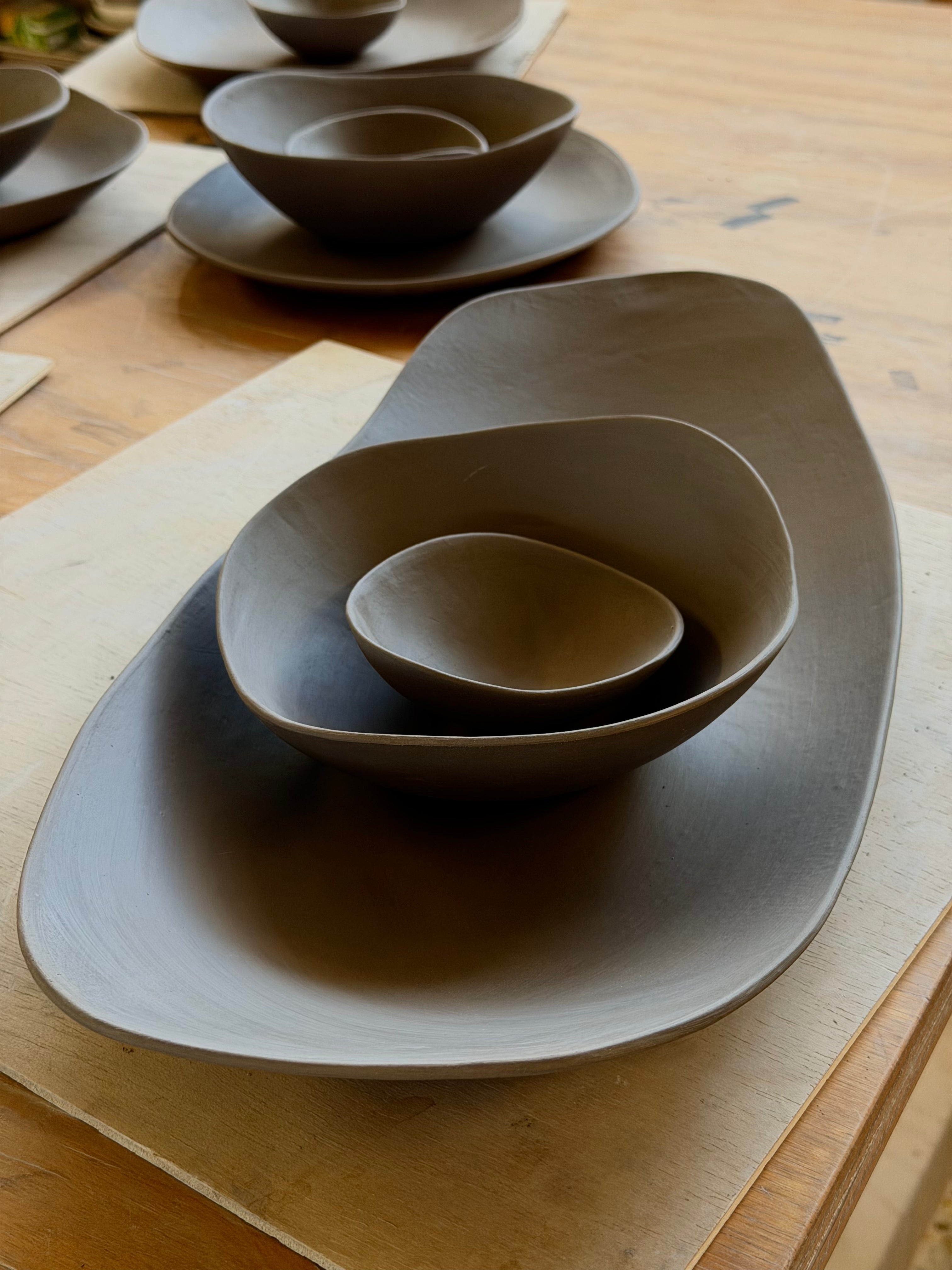 Handmade stoneware tableware exploring colour, asymetry and sculptural forms