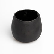     Handmade black stoneware sake cups with matte exterior and glossy glazed interior.