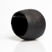     Handmade black stoneware sake cups with matte exterior and glossy glazed interior.