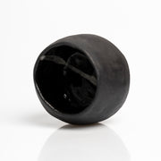     Handmade black stoneware sake cups with matte exterior and glossy glazed interior.