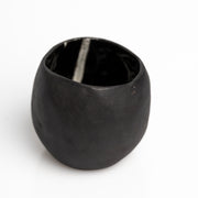     Handmade black stoneware sake cups with matte exterior and glossy glazed interior.