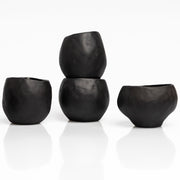     Handmade black stoneware sake cups with matte exterior and glossy glazed interior.