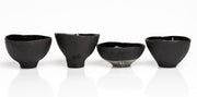    Handmade black stoneware snack bowls with unique hand-painted interiors.