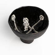     Handmade black stoneware snack bowl with unique hand-painted interiors.
