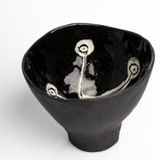     Handmade black stoneware snack bowl with unique hand-painted interiors.