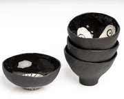     Handmade black stoneware snack bowl with unique hand-painted interiors.