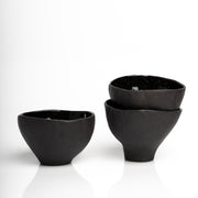     Handmade black stoneware snack bowls with unique hand-painted interiors.