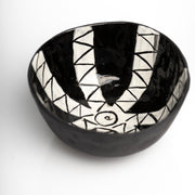     Handmade black stoneware snack bowl with unique hand-painted interiors.