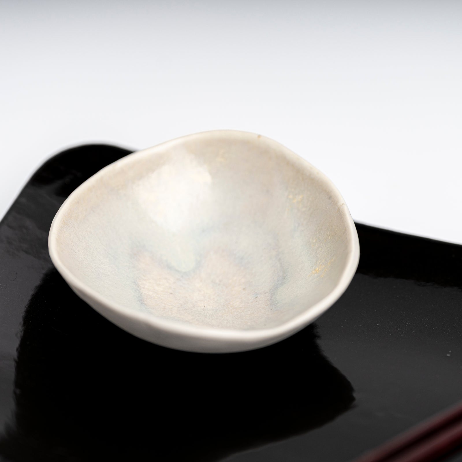     Handmade porcelain mini bowl with pearlescent glazed interio