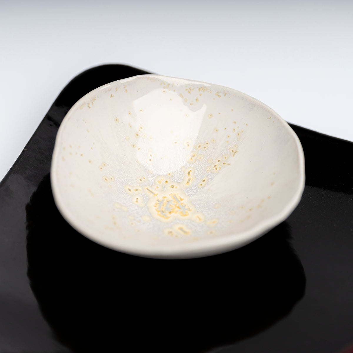     Handmade porcelain mini bowl with pearlescent glazed interio