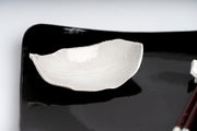     Handmade porcelain leaf dish with glossy white glaze.