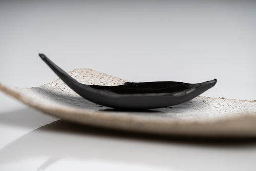  Handmade black leaf dish with glossy glaze.