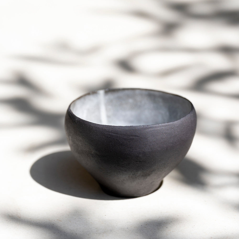 One-of-a-kind ceramic matcha bowl showing organic shape and cloud-like gla
