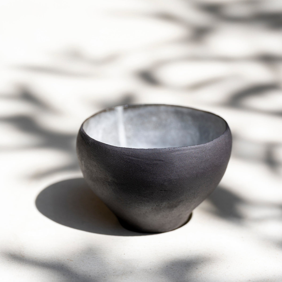 One-of-a-kind ceramic matcha bowl showing organic shape and cloud-like gla