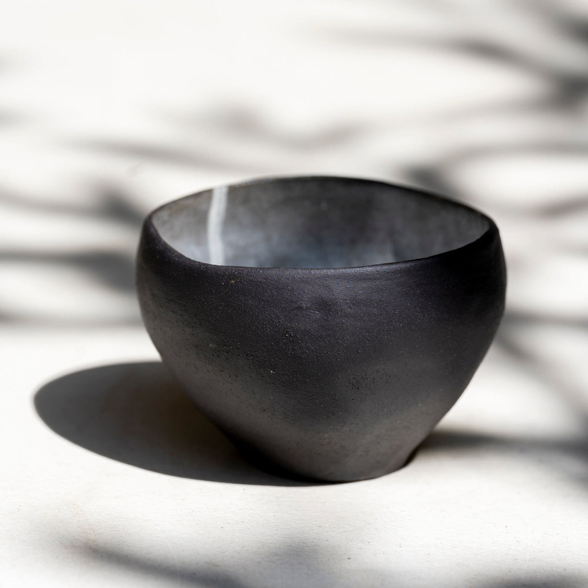     One-of-a-kind ceramic matcha bowl showing organic shape and cloud-like gla