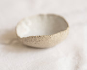     Handmade textured stoneware mini bowl with white glazed interior